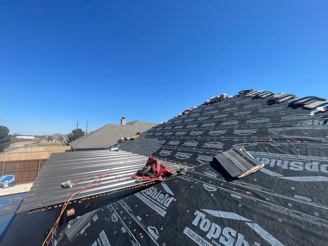 Metal roofing panels being installed on a West Texas home